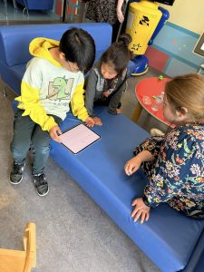 children trying new eye test on ipad