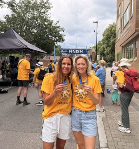 eyeYPAG leader and patient experience lead smiling with medals